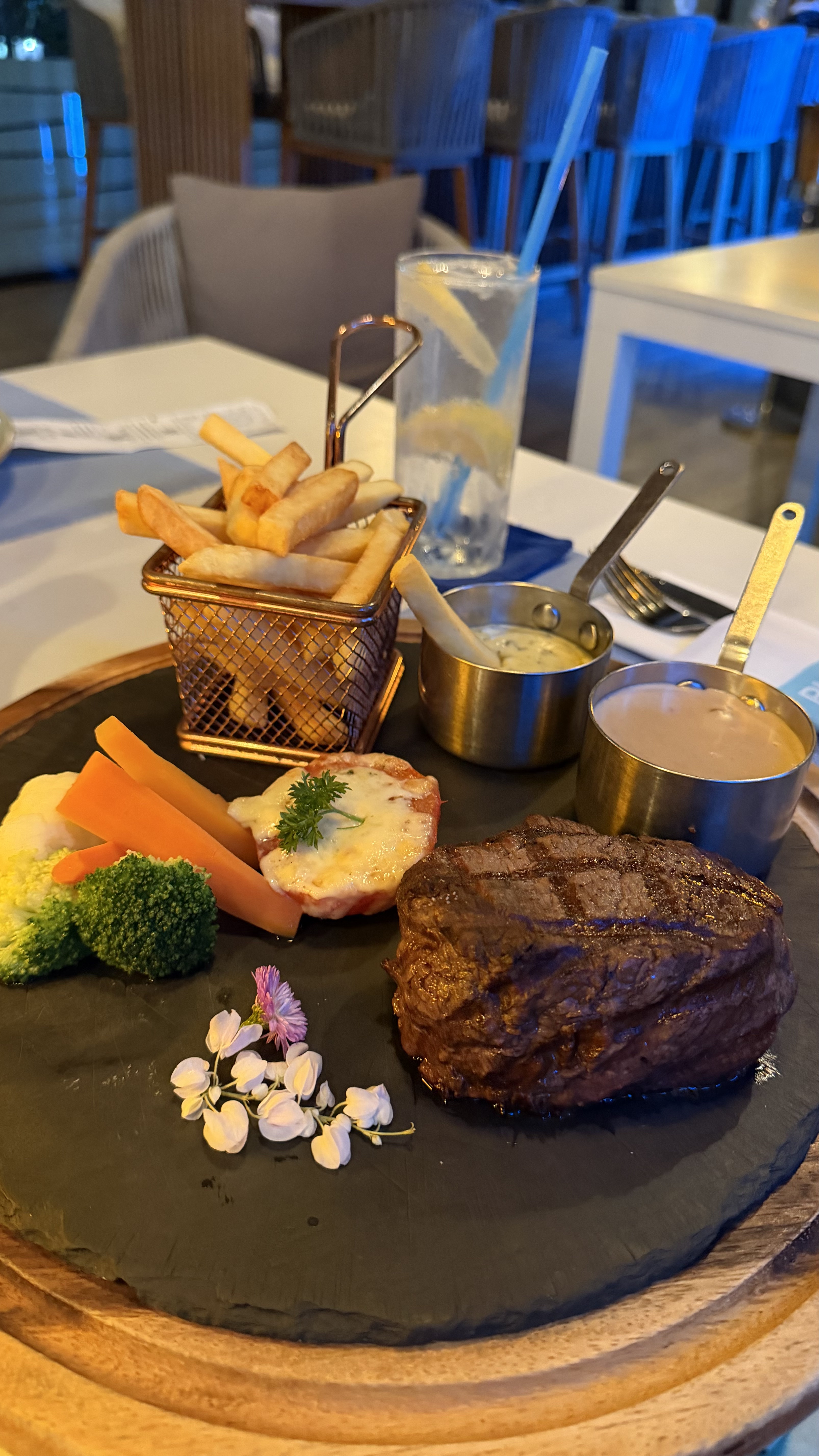 Premium steak with fries and vegetables